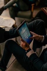 Close up shot of businessman unlocking the tablet