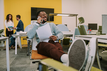 Young black business person having a phone call