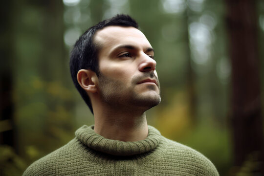 Medium shot portrait photography of a man in his 30s practicing mindfulness sophrology relaxation & stress-reduction wearing a cozy sweater against a forest background