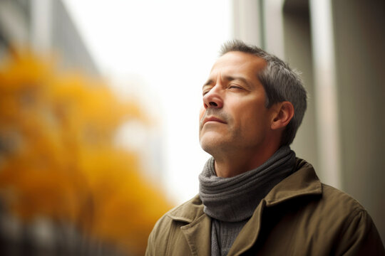 Medium shot portrait photography of a man in his 50s practicing mindfulness sophrology relaxation & stress-reduction wearing a cozy sweater against a modern architectural background