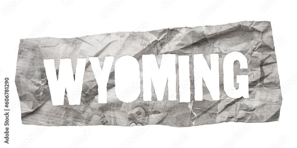 Wall mural wyoming state name cut out of crumpled newspaper in retro stencil style isolated on transparent back