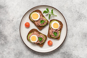 Open sandwich with tuna. Top view, flat lay.