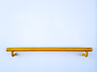 Yellow bar installed on white wall