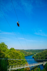 Pedestrian suspension bridge above Rappbodetalsperre lake and Rappbode River in Harz Mountains...