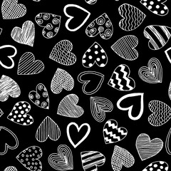 Hand drawn line art different shaped white hearts with waves,stripes,lines and dots as simple seamless pattern.Minimalistic Valentine's Day black background for cards,invitation,wrapping paper.