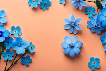 Top view of blue forget-me-nots frame on a pastel pinkish-orange background with copy space, flat lay