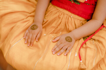 Artist applying henna tattoo on women . Mehndi is traditional Indian decorative art. Close-up