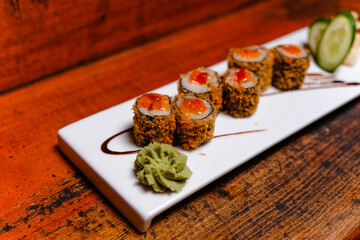 The mouth-watering sushi assortment on the alabaster stand was impressive.