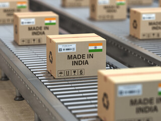 Made in India. Cardboard boxes with text made in India and  indian flag on the roller conveyor. - 606798852