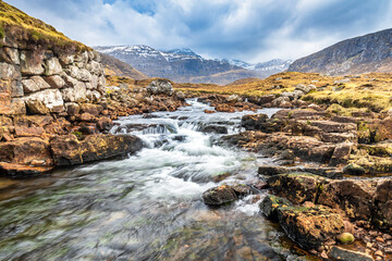 Naklejka na ściany i meble The Abhainn Sgaladail river flowing from the mountains of North Harris into Loch Shiphoirt and Loch Seaforth on the Isle of Harris, Outer Hebrides, Scotland