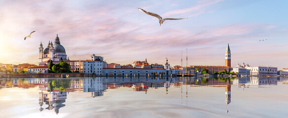 San Marco and Doge's Palace in the Venice lagoon at sunset, panoramic view, Italy © AlexAnton