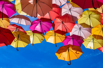 Fototapeta na wymiar Colorful Umbrellas Hanging As Street Decoration And Sun Protection In The City Of Bordeaux, France