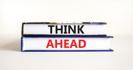 Think ahead symbol. Concept words Think ahead on beautiful books on a beautiful white table white background. Business, support, motivation, psychological and think ahead concept. Copy space.