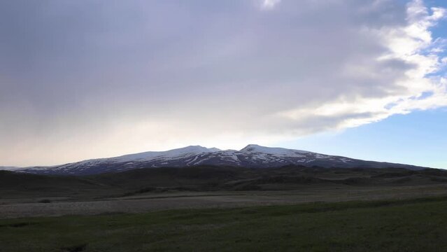 Captivating time-lapse footage showcasing the majestic Aragats mountain engulfed by dynamic clouds on a blustery spring day