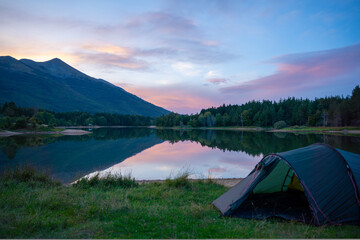 Wild camping next to a lake in Bosnia in a tent