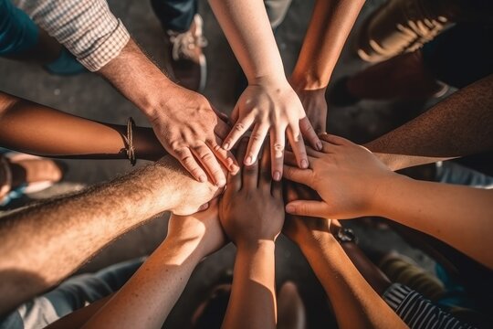 Close up of holding hands in a multi ethnic group of friends. Teamwork, connection and community concept. View from above. Generative AI illustration.