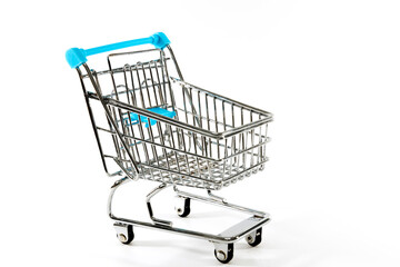 close-up of shopping trolley on white background with copy space