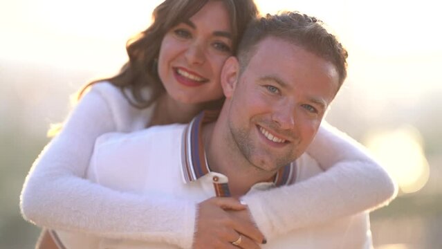 Happy couple in love posing in park in spring