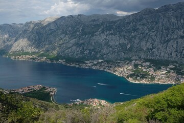 View of Bay of Kotor and towns on coast from tourist rail on Vrmac Peninsula, with the highest peak Sveti Ilija. Montenegro, Balkans