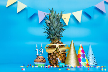 Creative background with pineapple character in sunglasses copy space. Happy birthday background...