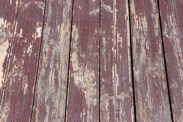 Closeup abstract background of a wooden deck slightly peeling by the sun