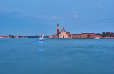 Fototapeta premium Scenic view of St George Church and Island in the Giudecca Canal, as seen at night from St Mark's district in Venice