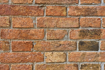 Fototapeta premium brick red wall. background of a old house.