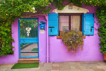 Fototapeta na wymiar Purple facade of a house in Burano, Venice
