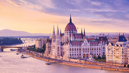 Fototapeta na wymiar City summer landscape at sunset - view of the Hungarian Parliament Building and Danube river in the historical center of Budapest, Hungary