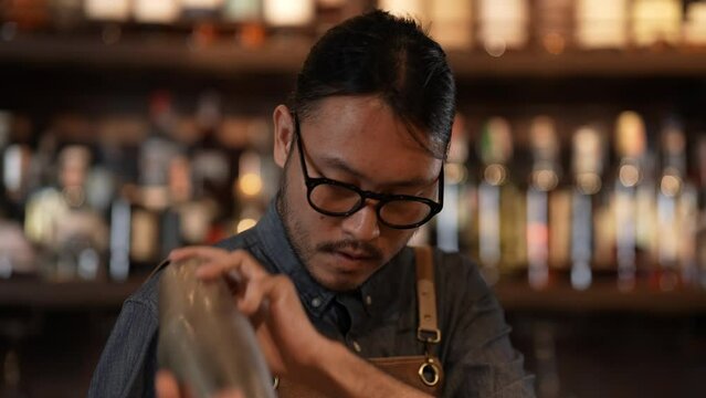 Night club concept of 4k Resolution. A bartender is making drinks for customers in a restaurant. A group of specialized clubs that sell alcoholic beverages.