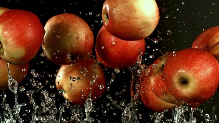 Apples fly up with water drops. Filmed is slow motion 1000 fps. High quality FullHD footage - Powered by Adobe