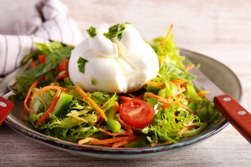 Fresh healthy salad with burrata cheese