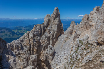Fototapeta premium Awesome summer dolomite rocky scenario in the Latemar Massif, UNESCO world heritage site. The main pinnacle is named Torre di Pisa. Trentino-Alto Adige, Italy, Europe