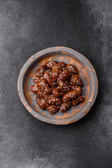 Chicken hearts fried in soy sauce with salt and spices in a plate
