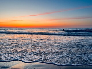 Orange sky after the sunset at the sea, evening sea horizon 