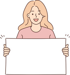 Woman holding blank white placard smiling and looking at camera demonstrating banner with copy space