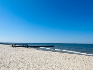 Blue seascape horizon, white sandy coastline