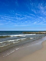 Blue seascape horizon, white sandy coastline