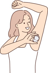 Woman raising hand using deodorant during morning hygiene routine to avoid sweat and odor