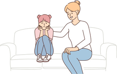 Mother stroking upset daughter on back sitting on couch after quarrel or important conversation