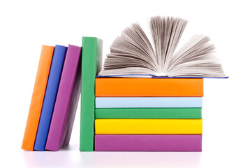 Composition with stack of books on a white background.