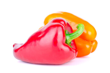 Two ripe juicy sweet peppers on a white background