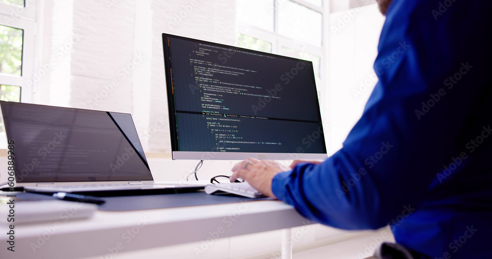 Fototapete Computer Programmer Writing Program Code On Computer