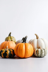 Group of assorted pumpkins isolated on white background, vertical. AI generated