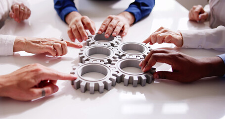 Diverse People Hands Holding Gear Wheels