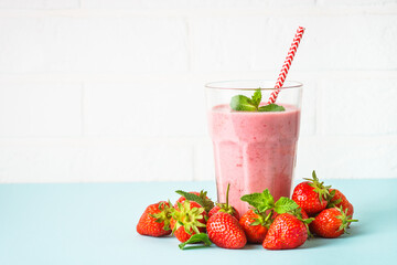 Strawberry smoothie or milkshake at blue.