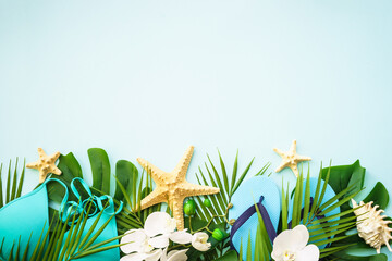 Summer vacation and travel concept. Palm leaves, hat, flip flop and sunglasses on white background....