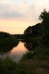 Fototapeta na wymiar Evening landscape, sunrise or sunset on the lake or the sea