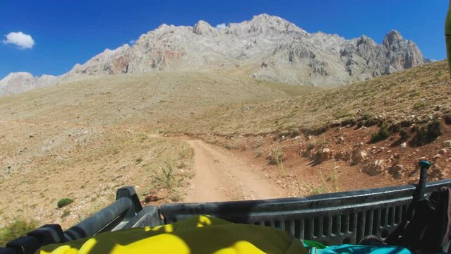 pickup truck rides on a mountain road against the backdrop of mountains. trip to the mountains.