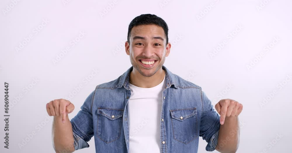Poster happy, face and an asian man pointing with a thumbs up isolated on a white background in a studio mo